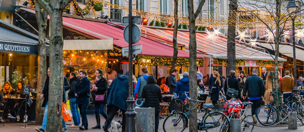 paris, france - january, 2020: urban scene crowd walking at street of paris, france - editorial horizontal cycling crowd imagens e fotografias de stock