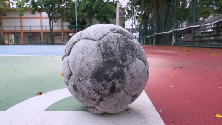 Old Soccer Ball On Soccer Pitch Truck Shot Slow Motion 4K