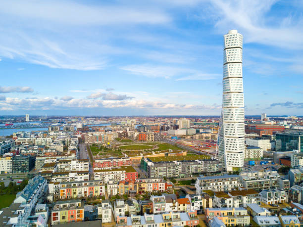 aerial view of the west harbor area with the turning torso skyscraper in malmo, sweden - malmö stockfoto's en -beelden