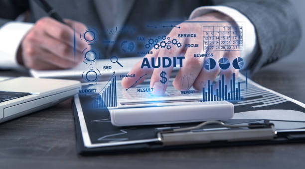 istock Human using calculator. Audit. Business charts with words 1437938975