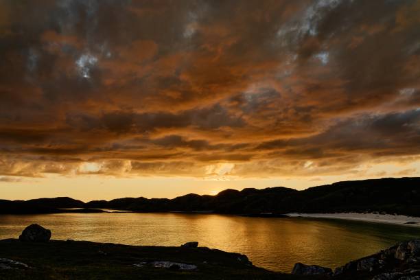istock Boulder and hills above Oldshoremore Beach Bay at sunset 1437943318