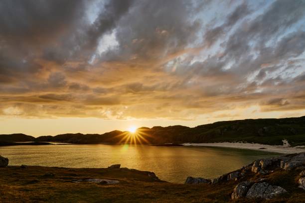 istock Boulder and hills above Oldshoremore Beach Bay at sunset 1437943631