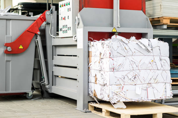 istock Paper and cardboard being compacted. Bales for recycling 1437943667