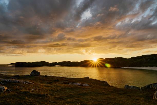 istock Boulder and hills above Oldshoremore Beach Bay at sunset 1437943700