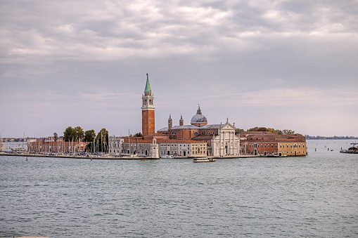 Venice, Italy - October 10th 2022:  View to the old church San Giorio Maggiore seen across the harbor in the center of the old and famous Italian city Venice