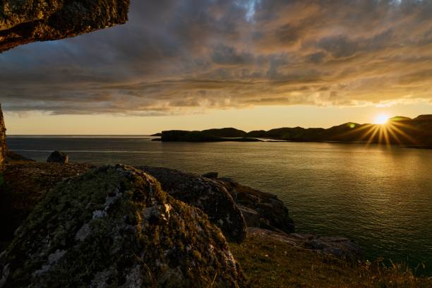 istock Boulder and hills above Oldshoremore Beach Bay at sunset 1437945533