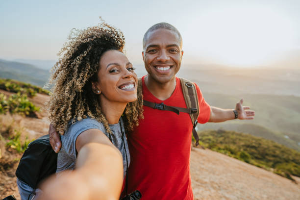 istock Couple walking on mountain trail 1437946769