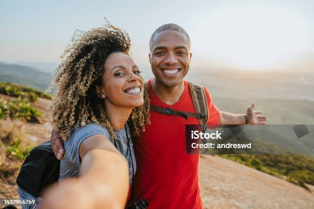 Couple Walking On Mountain Trail Stock Photo - Download Image Now - Hiking, Vitality, Vacations