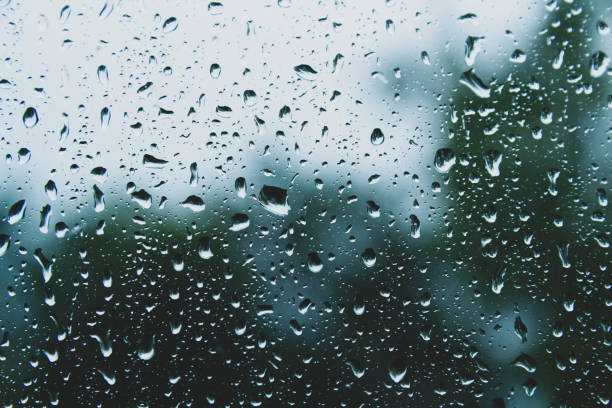 istock Sun after rain. Drops on glass. It's been raining. Texture on glass. 1437946926