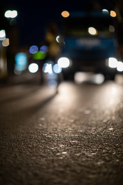 istock Blurred vehicle front view at night from street view 1437947761