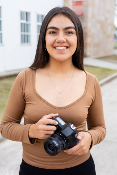 istock Young woman practicing photography art 1437949536