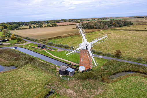 Viewed from the air the Horsey windpump in the Norfolk Broads, UK