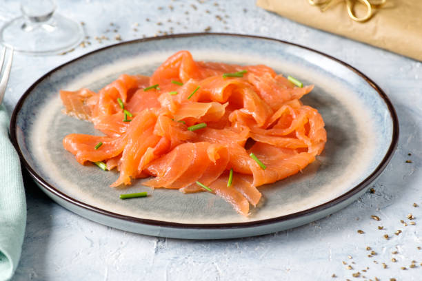 istock Slices of smoked salmon on the table. 1437951420