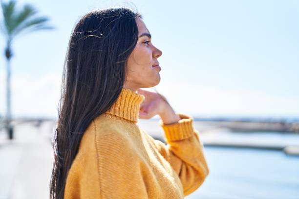 istock Young hispanic woman smiling confident standing at seaside 1437951874