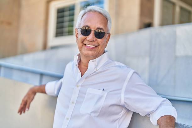 istock Middle age grey-haired man smiling confident standing at street 1437952520