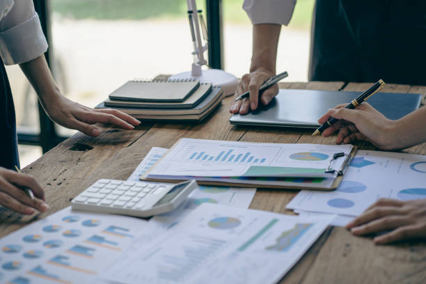 istock Business team discuss work analysis with graph data, market growth report, presentation and brainstorming on profit strategy planning, financial investment advisor, company accounting ideas. 1437954322