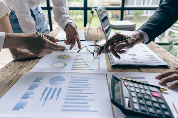 istock Business team discuss work analysis with graph data, market growth report, presentation and brainstorming on profit strategy planning, financial investment advisor, company accounting ideas. 1437954358