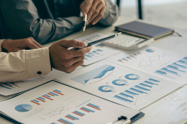 istock Business team discuss work analysis with graph data, market growth report, presentation and brainstorming on profit strategy planning, financial investment advisor, company accounting ideas. 1437954436