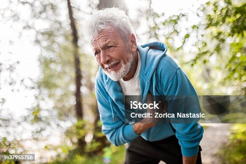 istock Senior man athlete having heart problems during jogging 1437955756