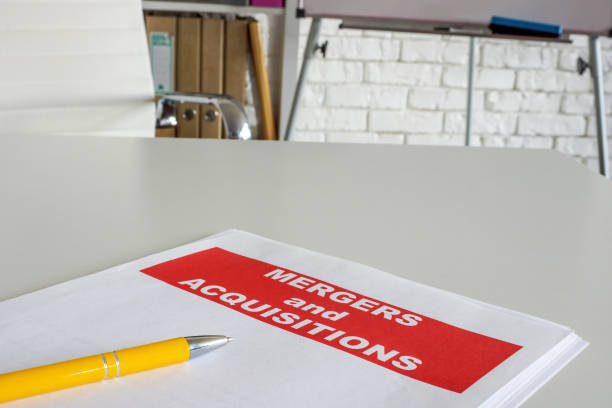 istock Documents about merger and acquisition on the office desk. 1437957956