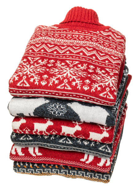 istock Stack of folded knitted Christmas turtleneck sweaters on white background 1437959123
