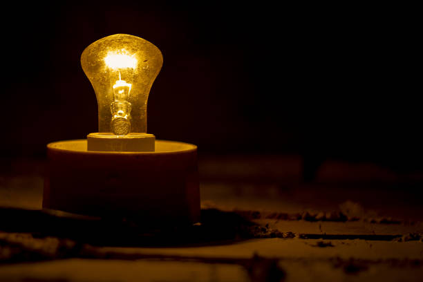 An old lamp dimly illuminates the space around it.