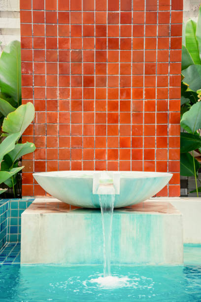 istock Waterfall jet at the swimming pool on daytime. 1437967619