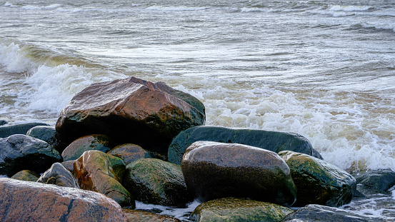 Baltic Sea, rocks at sunset. small waves after a night storm.