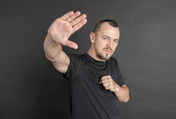 istock Young handsome serious man with hand palm raised up protest gesture 1437970353