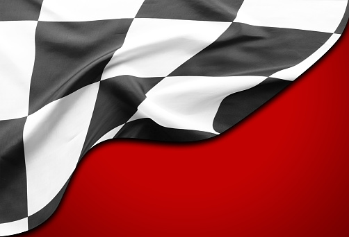 Checkered black and white flag on red background