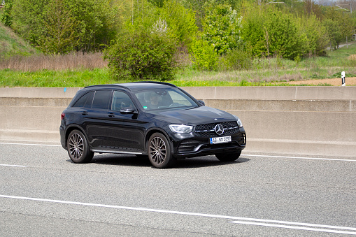 Diedenbergen, Germany - May 06, 2021: A Mercedes-Benz SUV on a highway nearby Wiesbaden, Germany. Mercedes-Benz is a German manufacturer of automobiles and trucks and a division of Daimler AG, formerly Daimler-Chrysler.