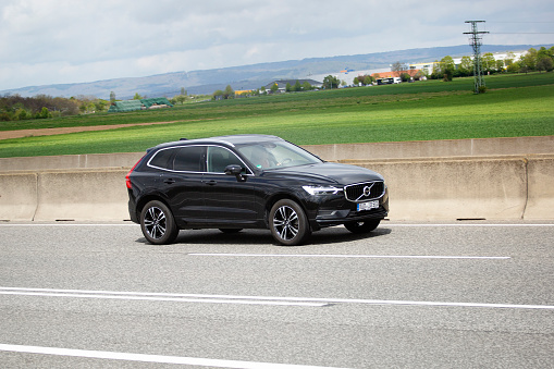 Diedenbergen, Germany - May 06, 2021: Volvo XC60 on a highway nearby Wiesbaden, Germany. Volvo XC60 is a compact luxury crossover SUV. Volvo Cars, stylized as VOLVO, is a Swedish luxury automobile manufacturer, it was founded in 1927 and is headquartered in Gothenburg, Sweden.