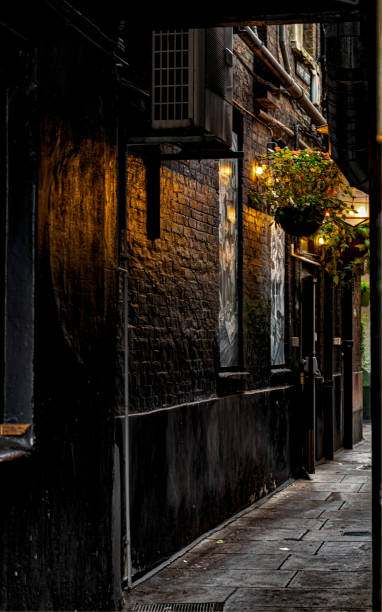 istock Dark alley behind a British pub 1437975155