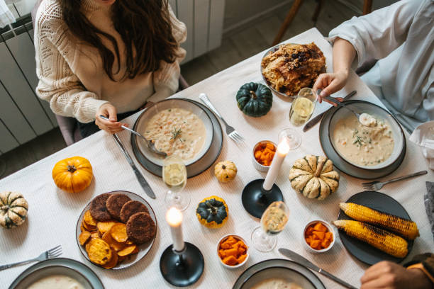 istock Family eating a Thanksgiving dinner 1437977758