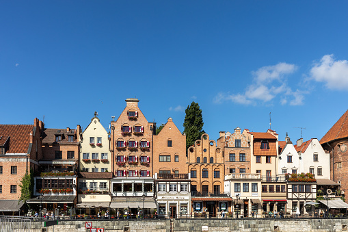 Gdansk, Poland - Sept 9, 2020: Gdansk, Old Town - historic buildings along the riverbank of Motlawa River, Poland