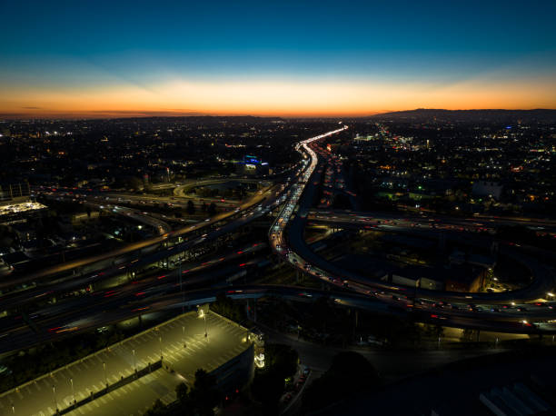 istock Traffic on Los Angeles Freeway at Dusk - Aerial View 1437979343
