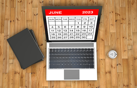June 2023 calendar on laptop