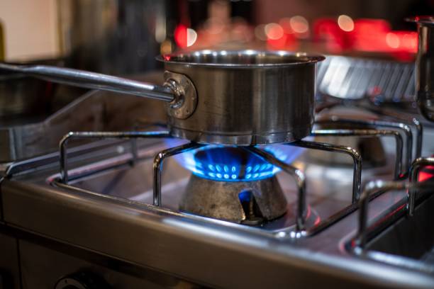 istock Aluminum pan on a gas stove 1437982428