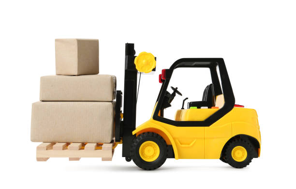 istock Toy forklift with wooden pallet and boxes on white background 1437984219