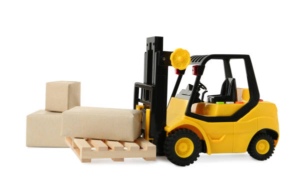 istock Toy forklift with wooden pallet and boxes on white background 1437984673