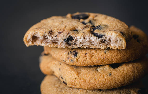 istock Chocolate chip cookies close up on a black background. 1437985698