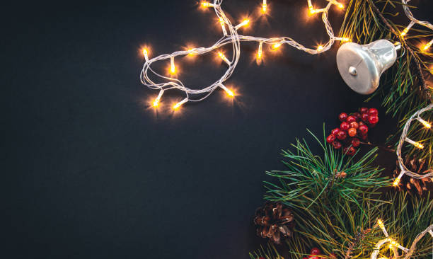 istock Dark Christmas background with garland and decor details, flat lay. 1437985708