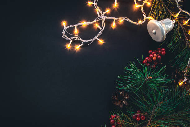 istock Dark Christmas background with garland and decor details, flat lay. 1437985709