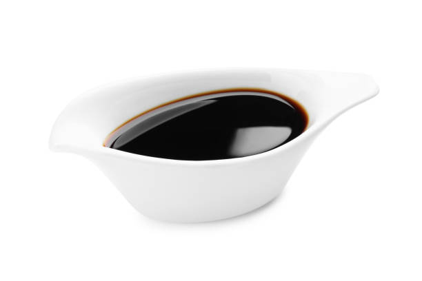istock Bowl of soy sauce isolated on white 1437987788