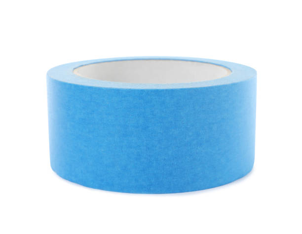 istock Roll of light blue adhesive tape isolated on white 1437988257