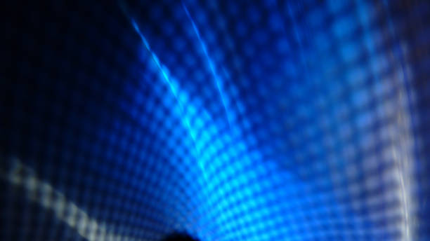 istock Progressive rhythmic blue shaded light layers seen through a net fence pattern 1437988709