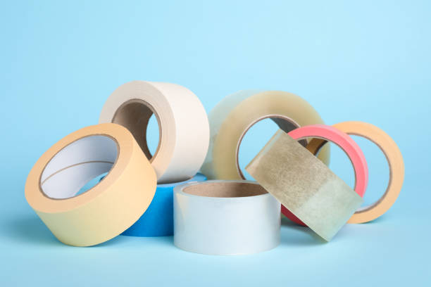 istock Many rolls of adhesive tape on light blue background 1437989307