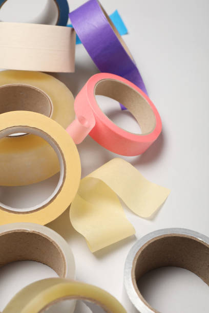 istock Many rolls of adhesive tape on light background 1437989308