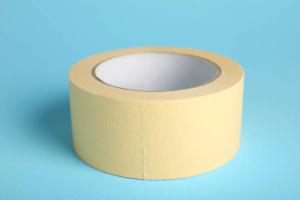 istock Roll of adhesive tape on light blue background 1437989390