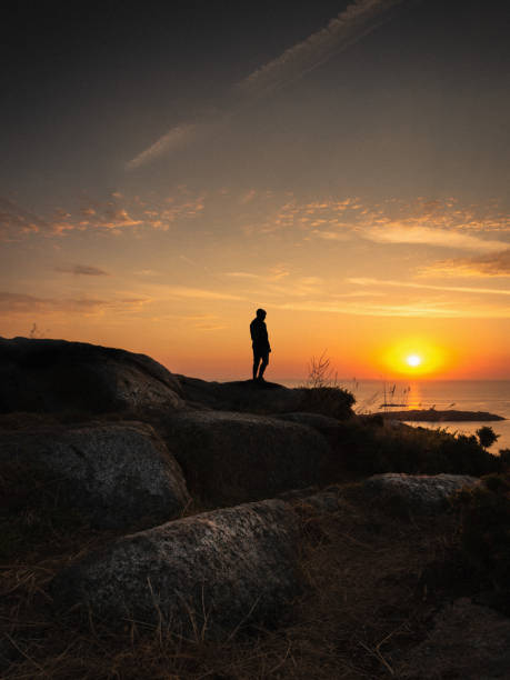 istock Alone in front of a rising sun 1437989429